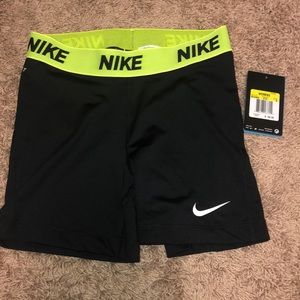 black and yellow nike pros